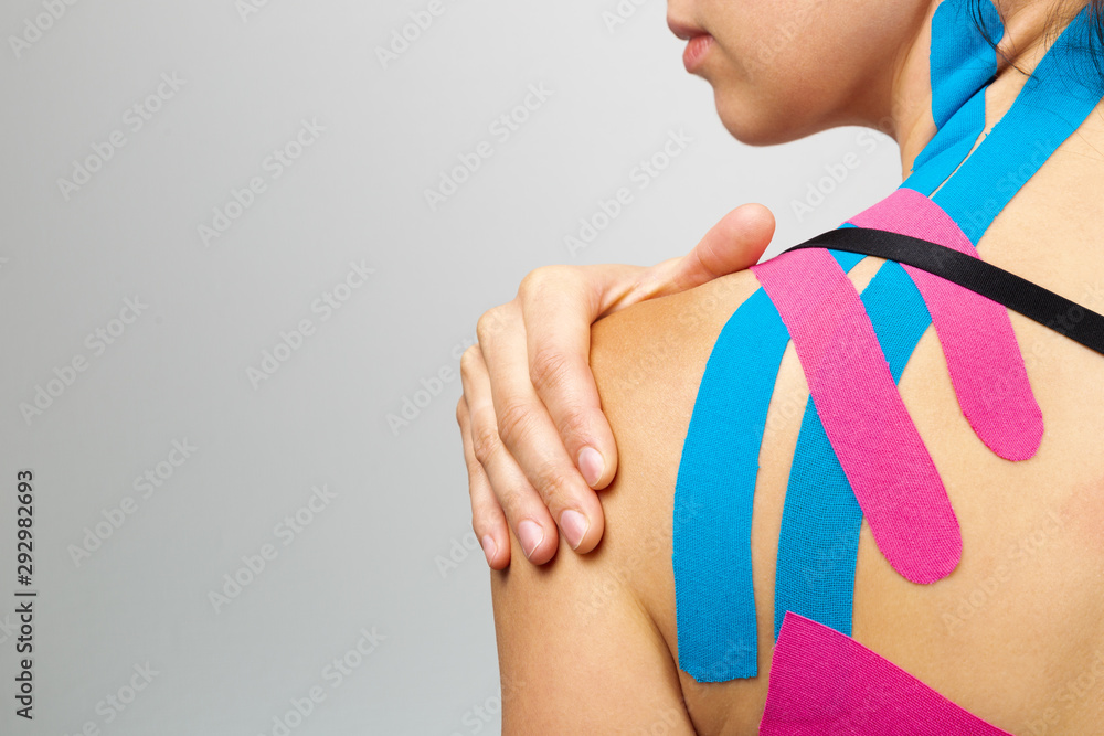 Multiple colored kinesiology tape rolls showing various color options for therapeutic application